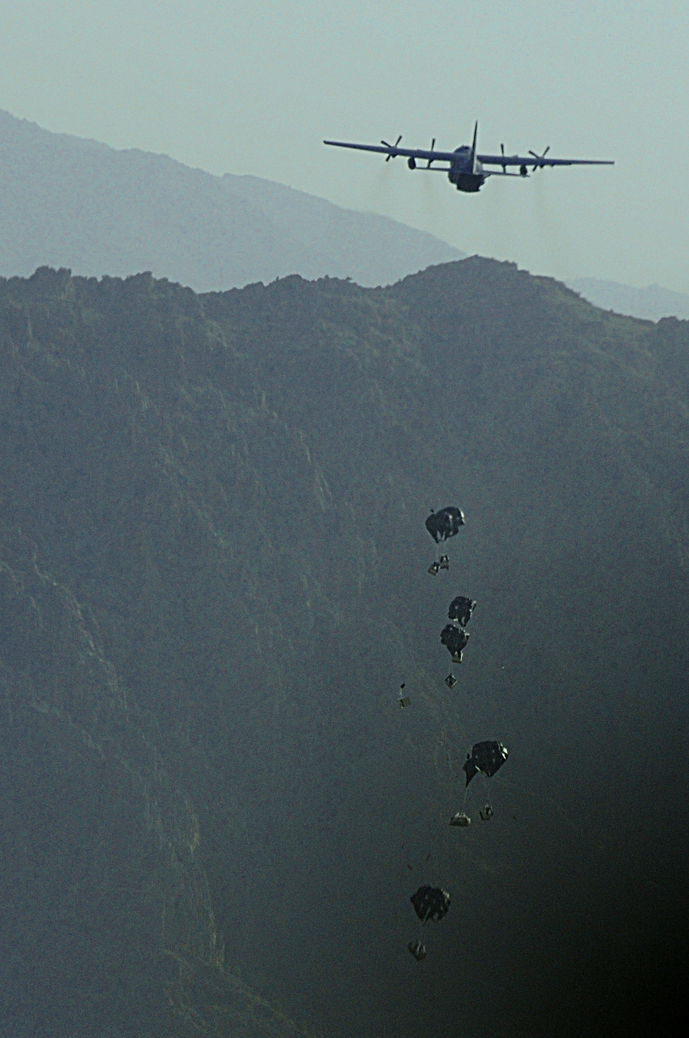 A C-130 Hercules aircrew from the New York Air National Guards 107th Airlift Wing airdrops supplies June 22, 2011, to a forward operating base in Oruzgan Province, Afghanistan. (U.S. Air Force photo/Senior Airman Krista Rose)